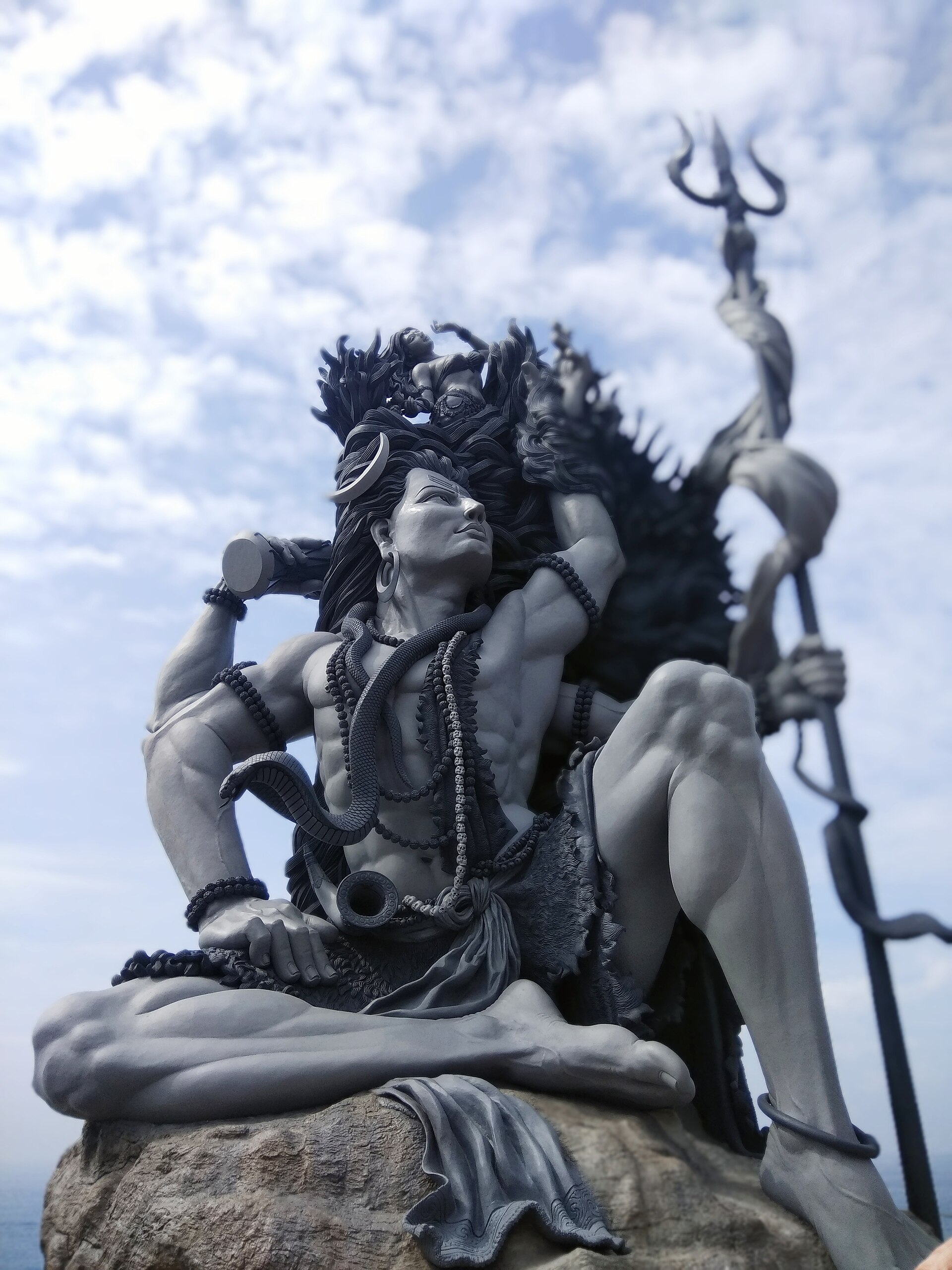 The dramatic Gangadhareshwara sculpture of Shiva at Azhimala, Kerala, against a vast sky